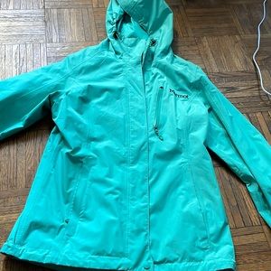 Manomet rain jacket. It is green/ turquoise looking.